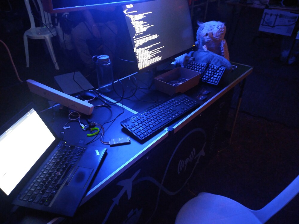 A laptop, monitor, keyboard and a raspberry pi zero wh
